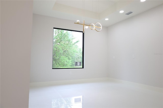 spare room featuring recessed lighting and visible vents