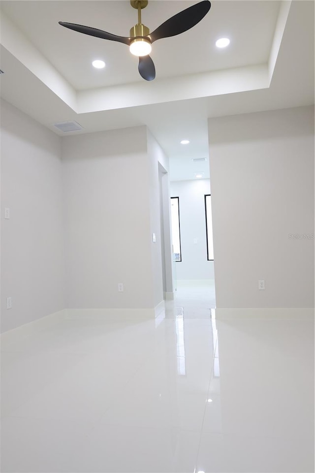 empty room with recessed lighting, ceiling fan, and light tile patterned floors