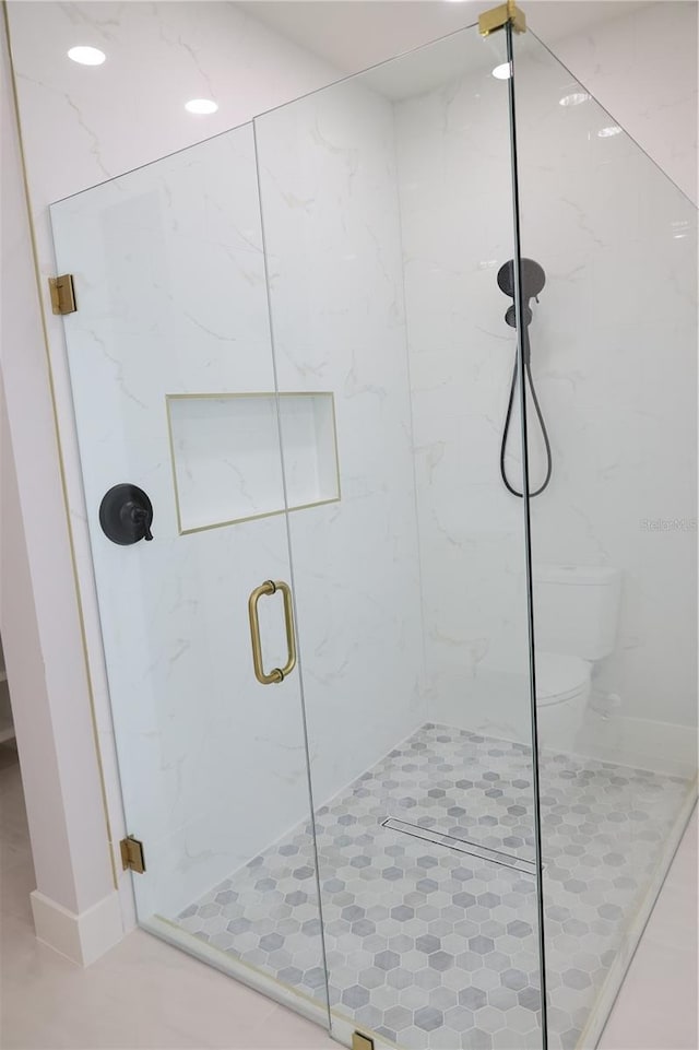 full bath with a shower stall and toilet