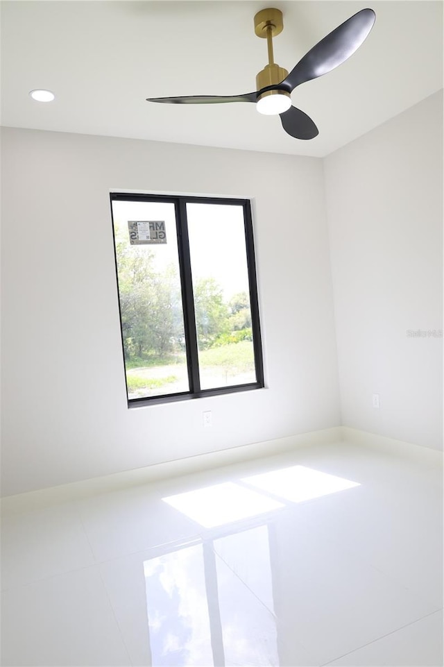 unfurnished room featuring a ceiling fan, tile patterned floors, and recessed lighting
