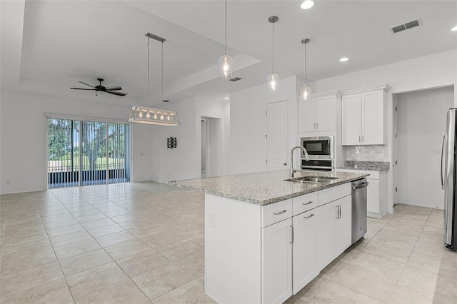 kitchen with a sink, stainless steel appliances, a ceiling fan, light tile patterned flooring, and recessed lighting