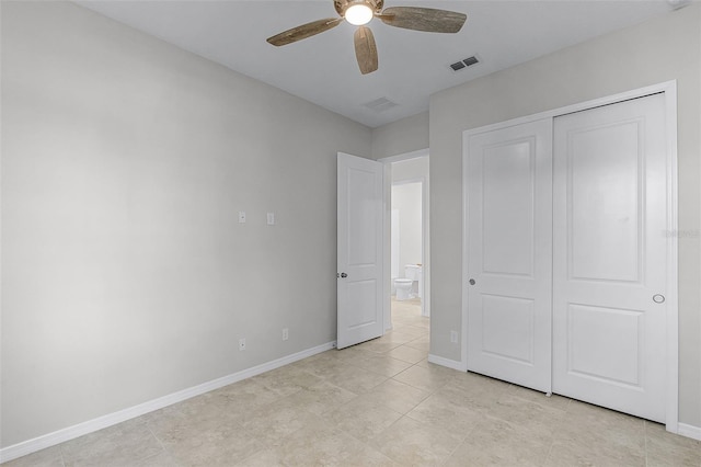 unfurnished bedroom with baseboards, a closet, ceiling fan, and light tile patterned flooring