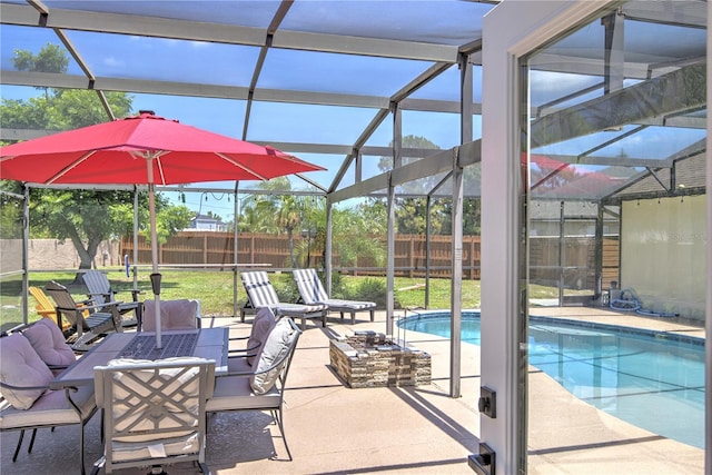 view of swimming pool with a lanai and a patio