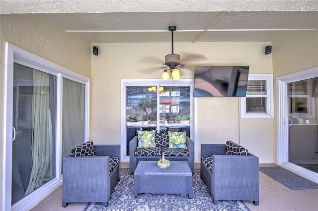 view of patio with outdoor lounge area and a ceiling fan