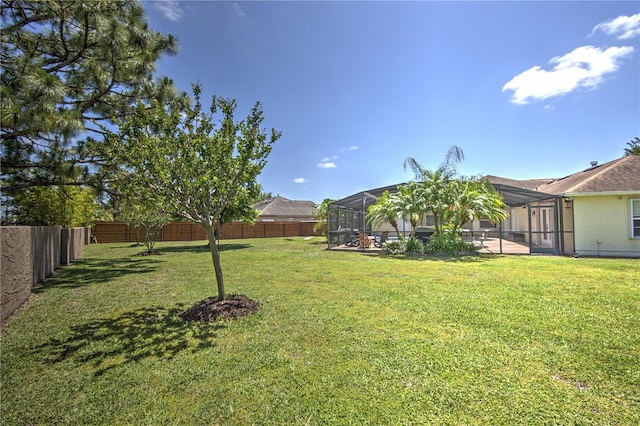 view of yard with a lanai