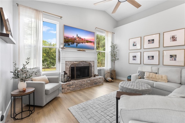 living room with a healthy amount of sunlight, a ceiling fan, and lofted ceiling