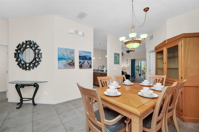 dining area featuring visible vents, baseboards, light tile patterned flooring, and a notable chandelier