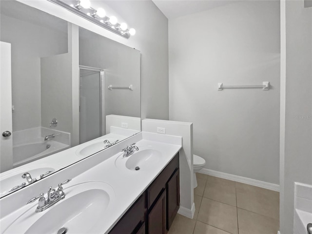 bathroom with a sink, tile patterned flooring, a stall shower, and a garden tub