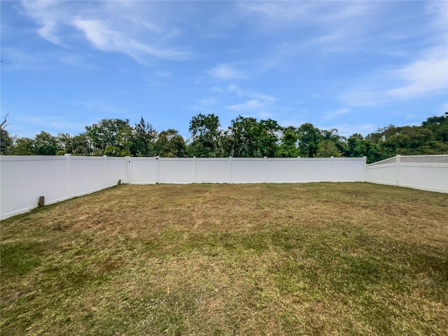 view of yard with a fenced backyard