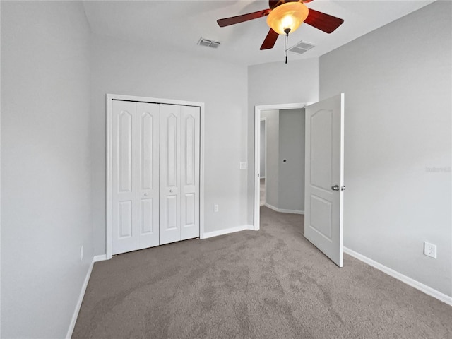 unfurnished bedroom featuring baseboards, visible vents, carpet, and a closet