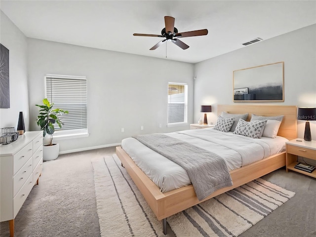 1123 Hacienda Cir, Kissimmee, FL 34741 - carpeted bedroom with visible vents, baseboards, and a ceiling fan