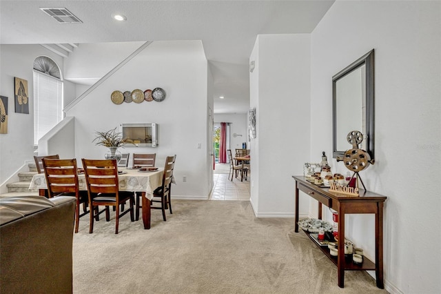 344 Cadiz Loop, Davenport, FL 33837 - dining space with light colored carpet, baseboards, recessed lighting, and stairs
