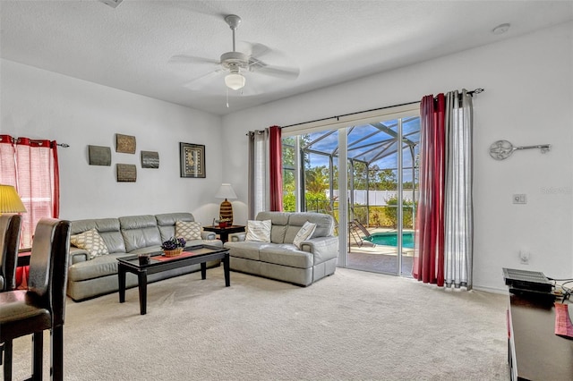 344 Cadiz Loop, Davenport, FL 33837 - carpeted living area with a ceiling fan and a textured ceiling