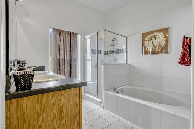 344 Cadiz Loop, Davenport, FL 33837 - full bathroom with a stall shower, tile patterned floors, a bath, and healthy amount of natural light