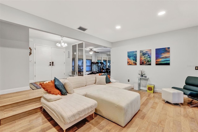 311 Needles Trl, Longwood, FL 32779 - living room featuring a chandelier, light wood-style floors, baseboards, and recessed lighting