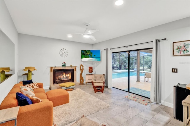 311 Needles Trl, Longwood, FL 32779 - living room with ceiling fan, a warm lit fireplace, recessed lighting, and baseboards