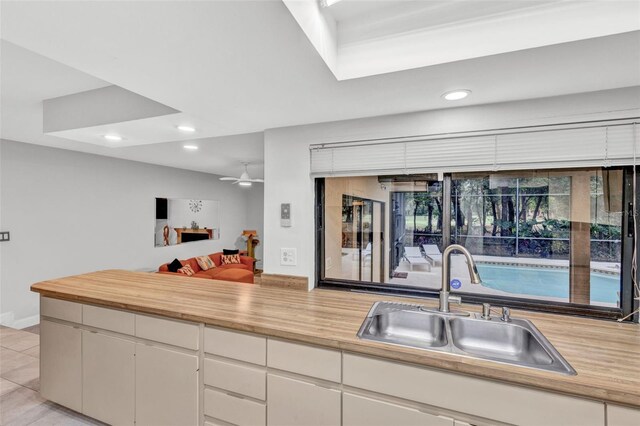 311 Needles Trl, Longwood, FL 32779 - kitchen featuring a sink, recessed lighting, butcher block countertops, open floor plan, and a ceiling fan