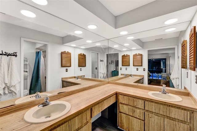 311 Needles Trl, Longwood, FL 32779 - full bath featuring recessed lighting, double vanity, and a shower with curtain