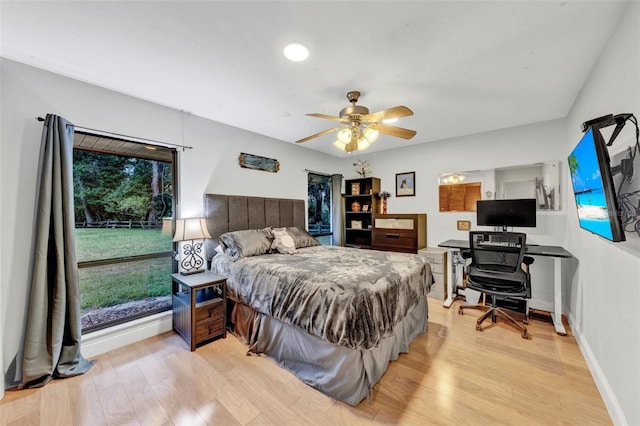 311 Needles Trl, Longwood, FL 32779 - bedroom with light wood-style flooring, a ceiling fan, and baseboards