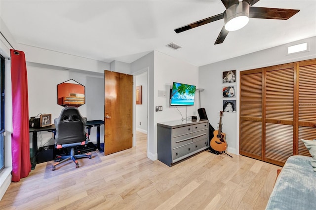 311 Needles Trl, Longwood, FL 32779 - bedroom with light wood-style flooring, a closet, ceiling fan, an office area, and baseboards