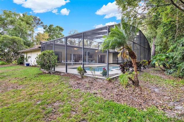 311 Needles Trl, Longwood, FL 32779 - back of property featuring an outdoor pool and a lawn