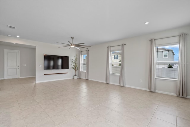 unfurnished living room with visible vents, light tile patterned flooring, baseboards, recessed lighting, and a ceiling fan