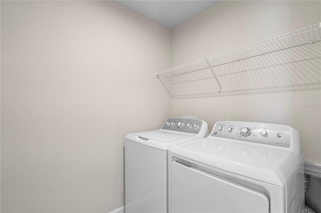 washroom with laundry area and washing machine and clothes dryer