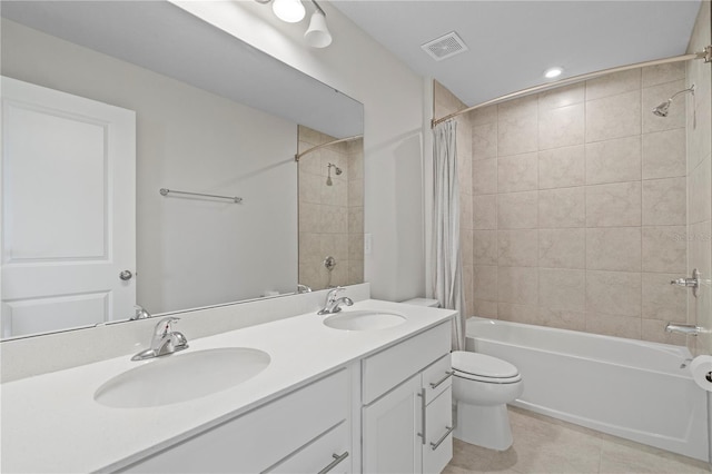 bathroom with visible vents, a sink, tile patterned flooring, and shower / tub combo