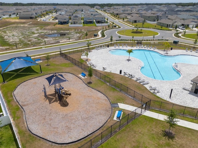 birds eye view of property with a residential view