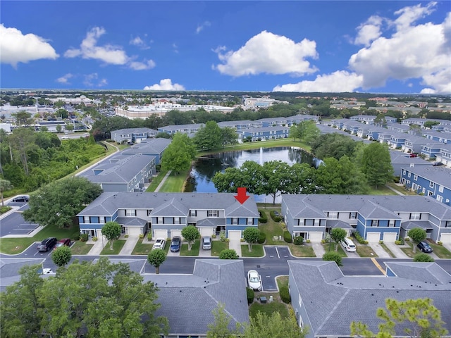 bird's eye view featuring a water view and a residential view
