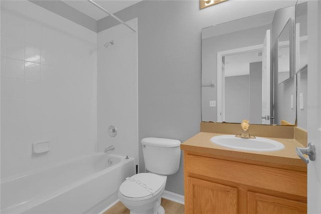 full bathroom featuring toilet, washtub / shower combination, and vanity