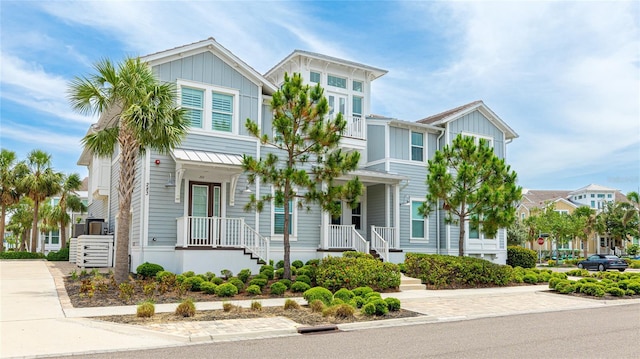 283 Saint Lucia Dr Unit 202, Bradenton, FL 34209 - view of front of house with board and batten siding, a residential view, and a porch