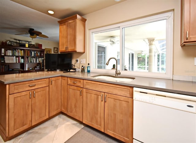 2900 Cullen Lake Shore Dr, Belle Isle, FL 32812 - kitchen featuring dishwasher, ceiling fan, a sink, a peninsula, and light tile patterned floors