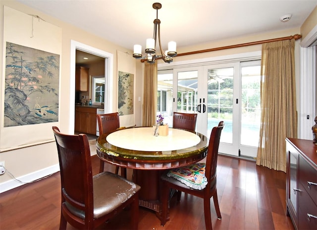 2900 Cullen Lake Shore Dr, Belle Isle, FL 32812 - dining space featuring french doors, dark wood-type flooring, and a chandelier
