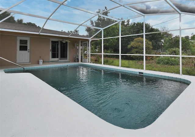 2900 Cullen Lake Shore Dr, Belle Isle, FL 32812 - outdoor pool featuring ceiling fan, a patio area, and glass enclosure