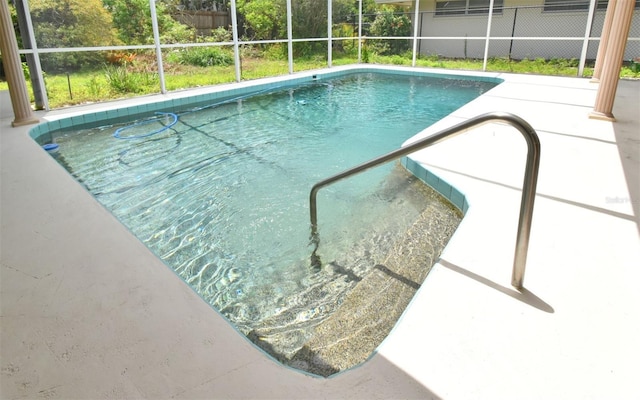2900 Cullen Lake Shore Dr, Belle Isle, FL 32812 - outdoor pool featuring fence, a patio area, and a lanai