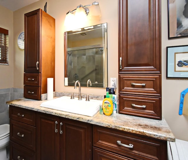 2900 Cullen Lake Shore Dr, Belle Isle, FL 32812 - bathroom featuring a shower stall, toilet, and vanity