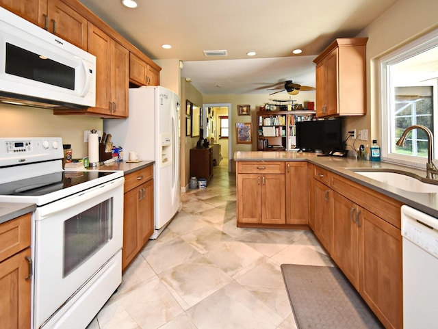 2900 Cullen Lake Shore Dr, Belle Isle, FL 32812 - kitchen featuring white appliances, a sink, plenty of natural light, a peninsula, and recessed lighting