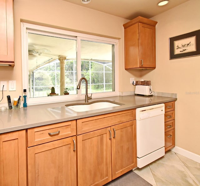 2900 Cullen Lake Shore Dr, Belle Isle, FL 32812 - kitchen with white dishwasher, a sink, light countertops, baseboards, and recessed lighting