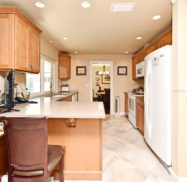2900 Cullen Lake Shore Dr, Belle Isle, FL 32812 - kitchen featuring white appliances, a sink, a peninsula, recessed lighting, and light countertops