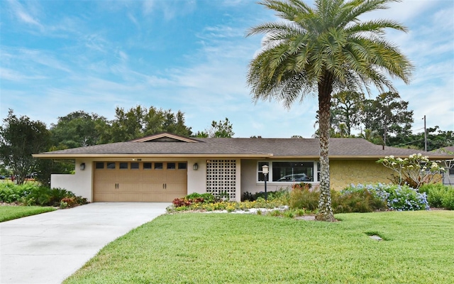 2900 Cullen Lake Shore Dr, Belle Isle, FL 32812 - ranch-style home featuring a garage, stucco siding, a front lawn, and concrete driveway