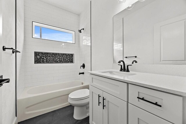 6709 SW 15th Pl, Gainesville, FL 32607 - full bath featuring toilet, vanity, and washtub / shower combination