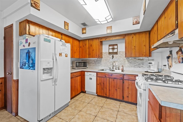 kitchen featuring a sink, light countertops, white appliances, and visible vents