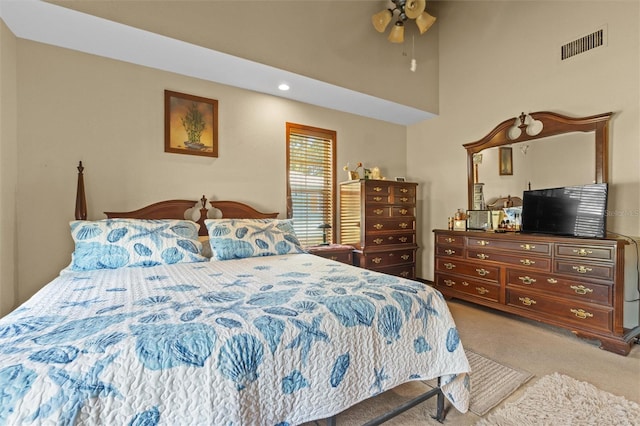 bedroom featuring visible vents, carpet flooring, and ceiling fan