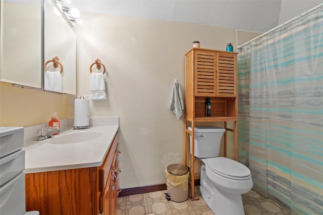 bathroom with vanity, toilet, a textured ceiling, tile patterned floors, and a shower with shower curtain