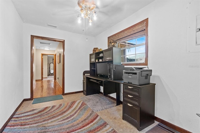 office with baseboards, ceiling fan, and visible vents