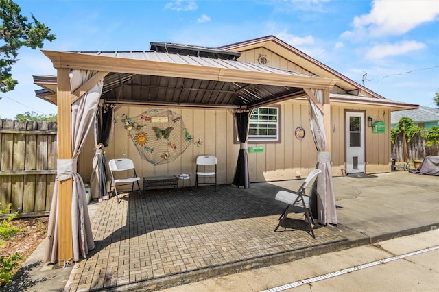 exterior space with a patio, fence, and a gazebo