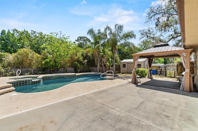 view of pool featuring a storage shed, a patio area, a gazebo, an outdoor structure, and a fenced backyard