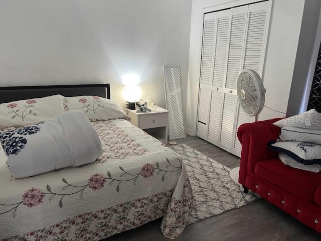 bedroom featuring a closet and wood finished floors