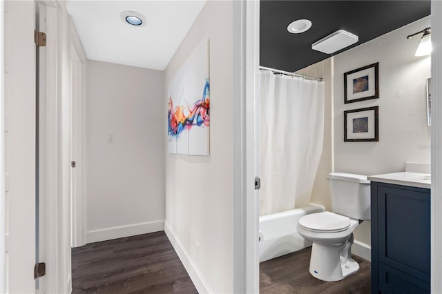 111 Crown Oaks Way Unit 101, Longwood, FL 32779 - full bathroom with toilet, vanity, wood finished floors, and shower / tub combo with curtain